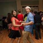 Man and woman smiling and dancing